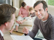 men talking while woman and child on background my children