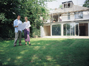 couple looking at building plan borrow