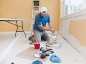 man painting walls home