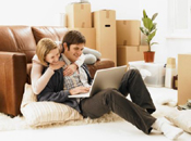 couple with notebook just moved home